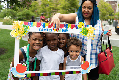 Foster mom with her 4 foster children at family fun day