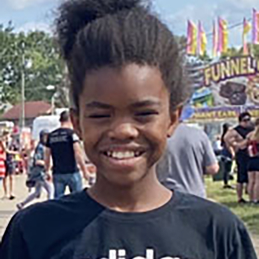 young man smiling outside