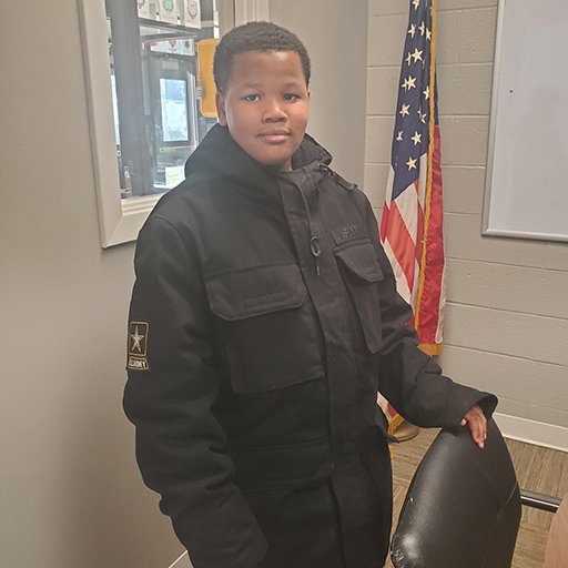 young man standing and smiling