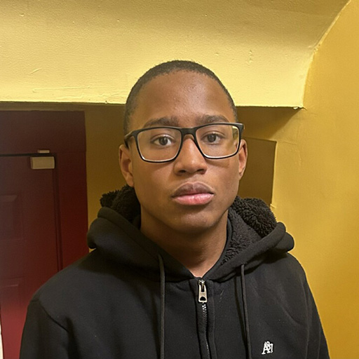 young man standing in a room