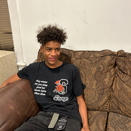 young man sitting and smiling