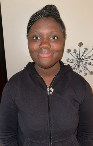 young woman standing and smiling