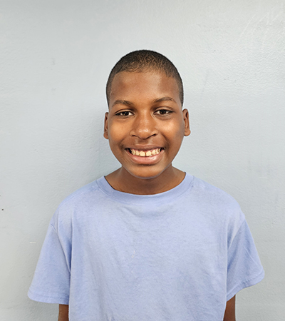 young man standing and smiling