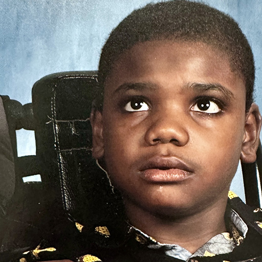 young man sitting and smiling