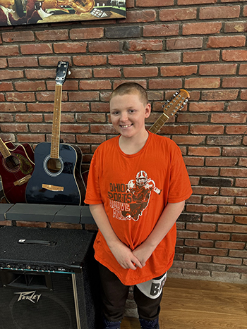 young man standing and smiling