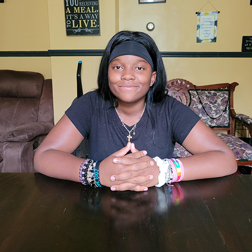 young woman sitting and smiling