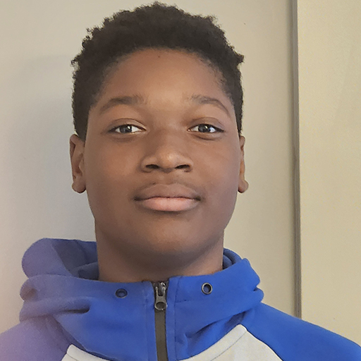 young man standing and smiling