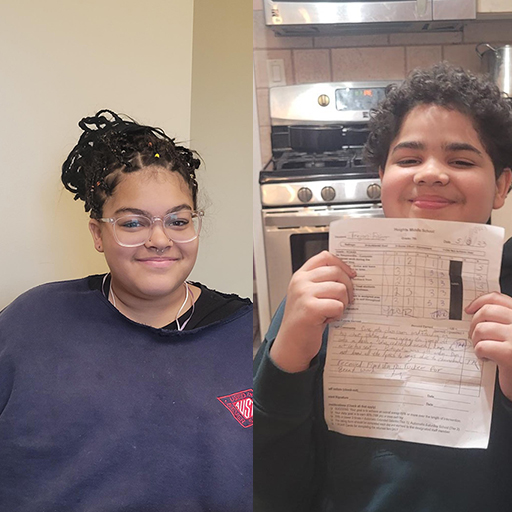 young woman smiling and young man holding up report card and smiling