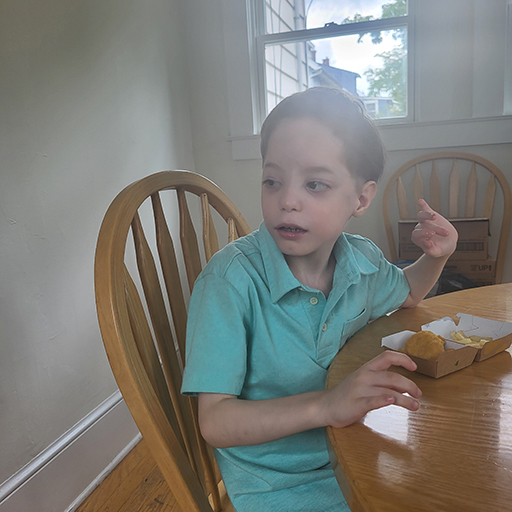 boy sitting and smiling